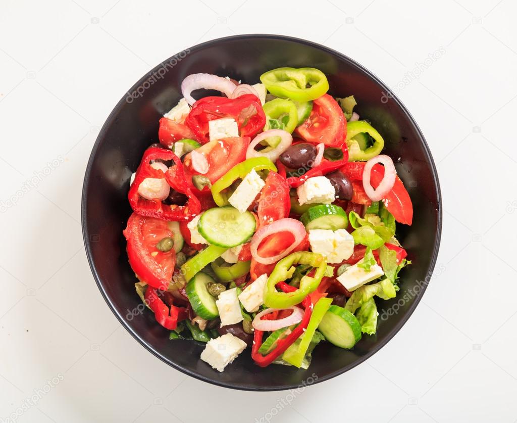 Greek salad on white background