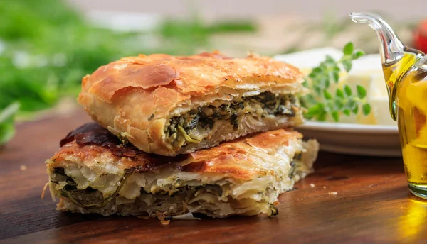 Spinach pie pieces on a table — Stock Photo, Image