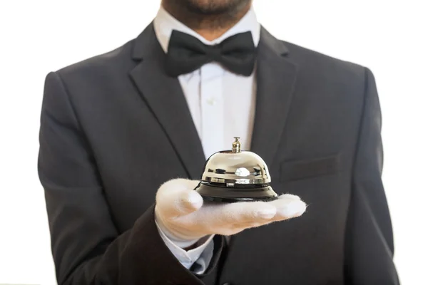 Cloche de service Butler dans une main gantée — Photo