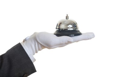 Butler service bell in a gloved hand clipart