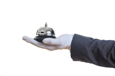 Uşak hizmeti çanı eldivenli elinde