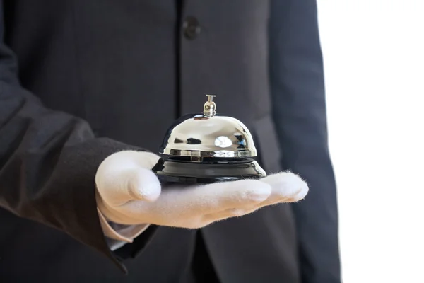 Butler service bell in a gloved hand — Stock Photo, Image