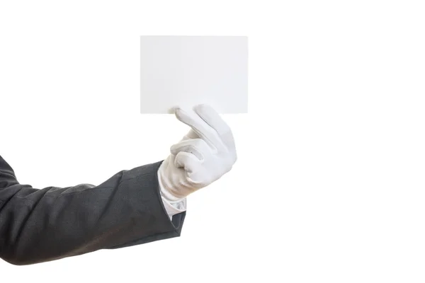 Mão enluvada segurando um cartão em branco — Fotografia de Stock