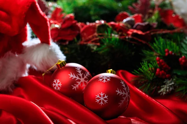 Christmas balls on red satin — Stock Photo, Image