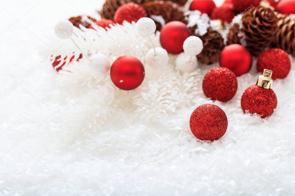 Christmas balls and snow on white background