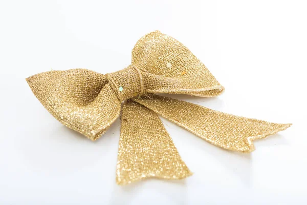 Golden bow on white background — Stock Photo, Image