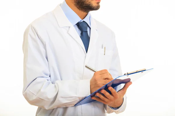 Doctor holding a clipboard on white background — Stock Photo, Image