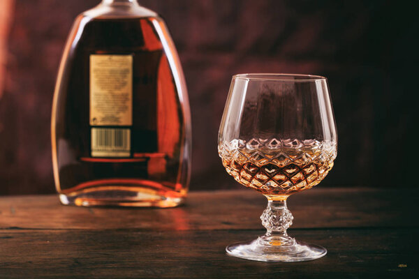 Bottle and crystal glass of cognac