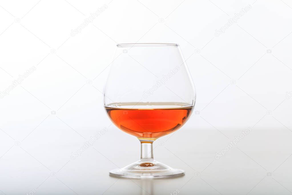 Cognac glass on white background