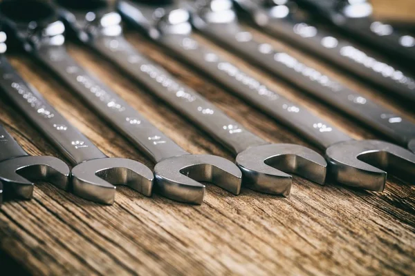 Set of wrenches on wooden background — Stock Photo, Image