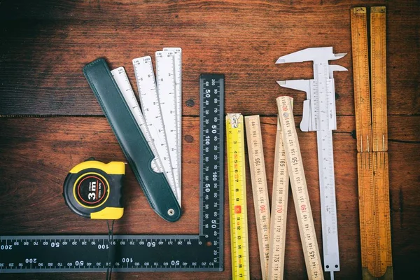 Variety of meters on wooden background — Stock Photo, Image