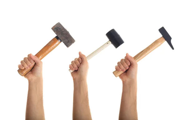 Hands holding hammers on white background — Stock Photo, Image