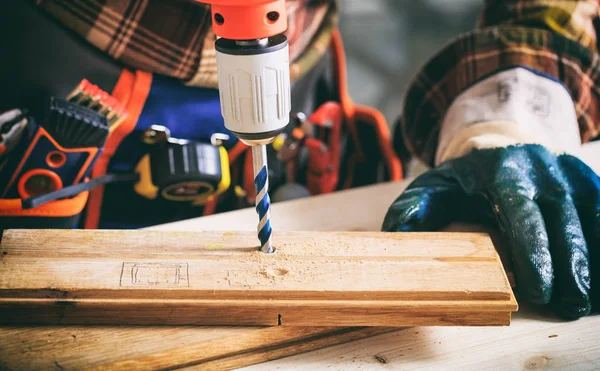 Worker holding an electric drill — Stock Photo, Image