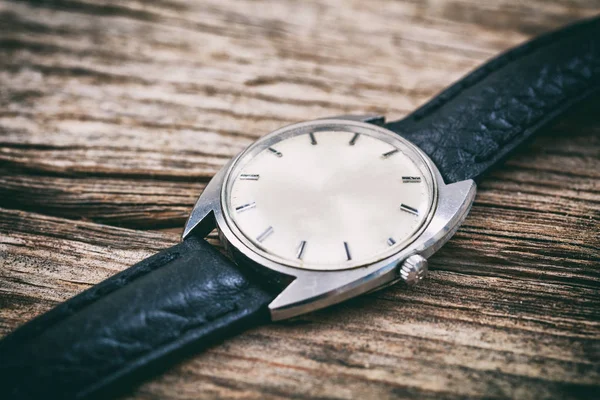 Vintage watch on wooden background