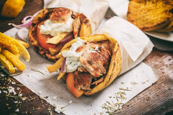 Greek gyros wraped in a pita bread — Stock Photo, Image