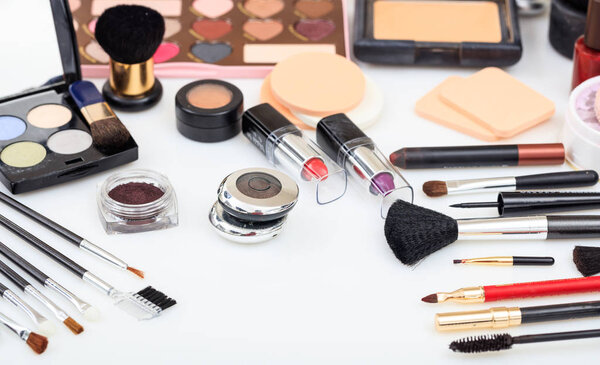 Set of makeup tools on white background