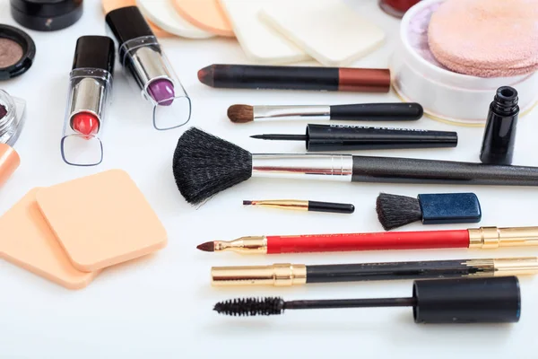 Set of makeup tools on white background