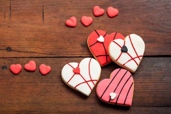 Heart shaped biscuits on wooden background — Stock Photo, Image