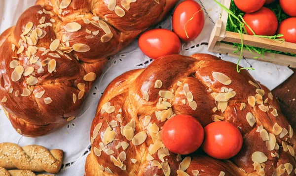 Easter bread and eggs on a table - top view — Stock Photo, Image