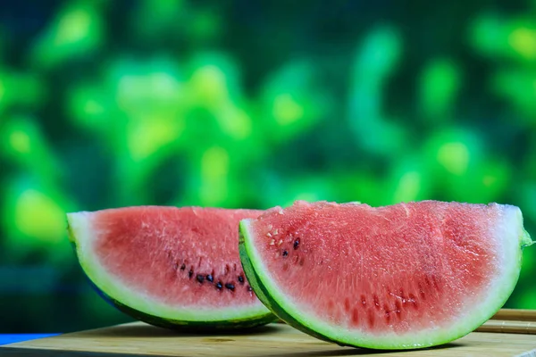 Watermelon slices on a wooden table — Stock Photo, Image