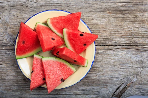 Watermelon pieces on a wooden board — Stock Photo, Image