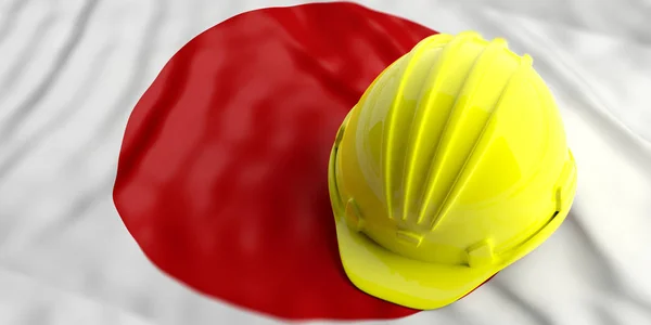 Yellow helmet over Japan flag. 3d illustration