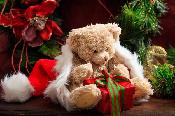 Christmas decoration, teddy bear and a gift — Stock Photo, Image