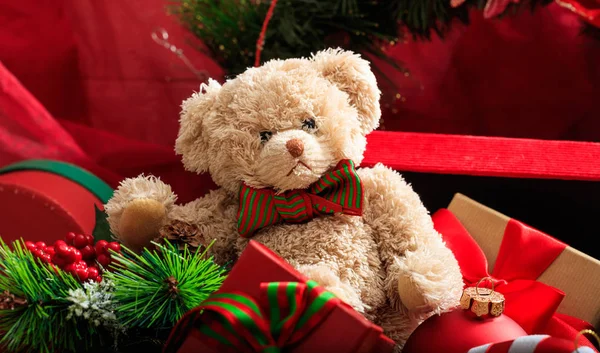 Christmas balls, teddy bear and gifts — Stock Photo, Image