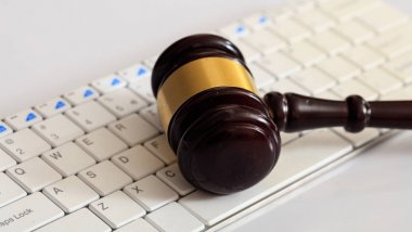 Auction or Judge gavel on a computer keyboard clipart