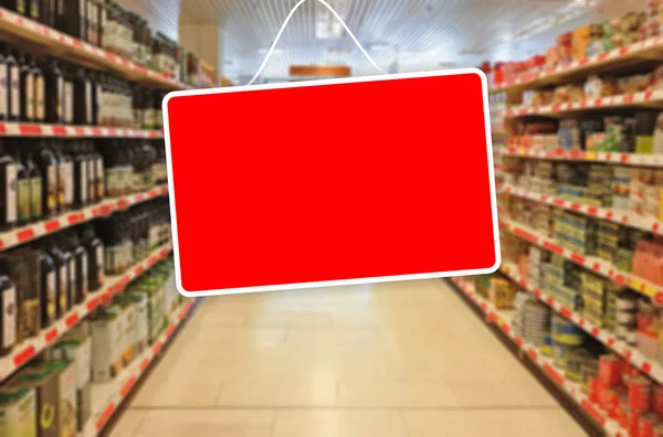 Red empty label on an abstract Supermarket background — Stock Photo, Image