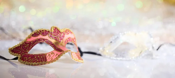 Pink carnival mask on bokeh background — Stock Photo, Image