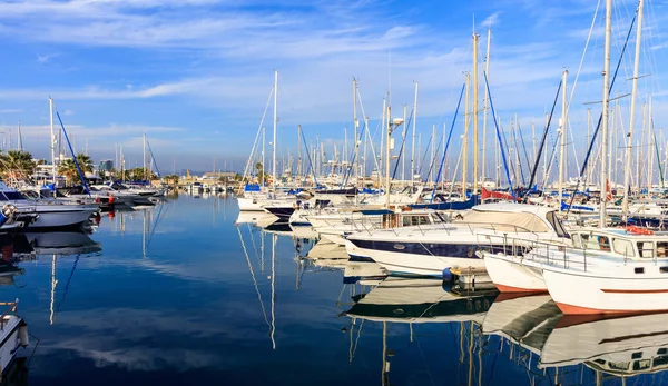 Reflection of boats laying in a marina at Larnaca, Cyprus. Blue sky and sea background. — Stock Photo, Image