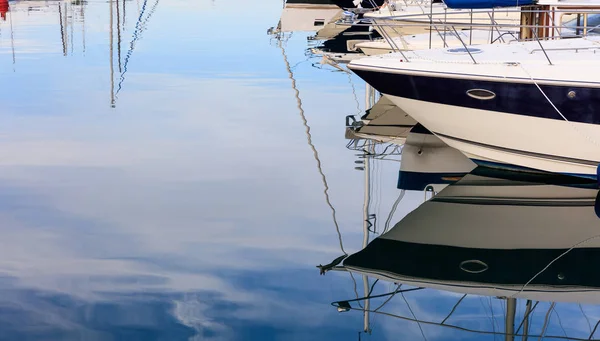 Reflection of boats laying in a marina at Larnaca, Cyprus. Blue sky and sea background. — Stock Photo, Image