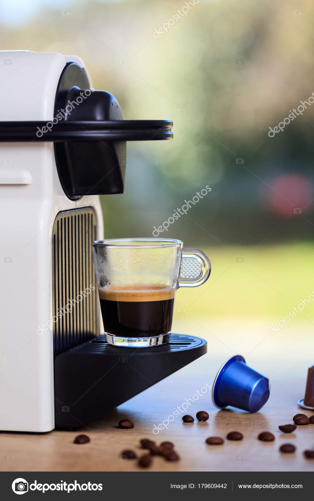 Espresso Coffee Machine On A Wooden Table Blur Green Background