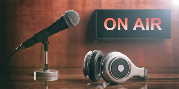 ON AIR written on a black box, headphones and a microphone. 3d illustration — Stock Photo, Image