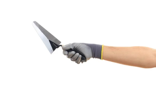 Mão segurando uma espátula no fundo branco — Fotografia de Stock