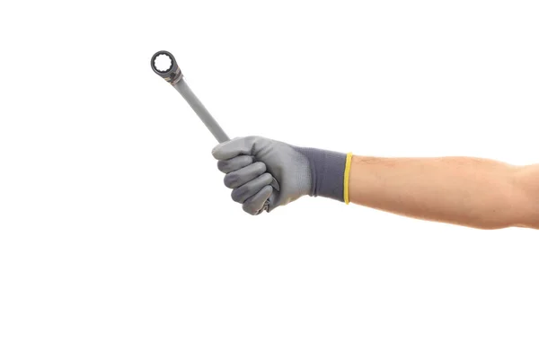 Hand holding a metal spanner on white background — Stock Photo, Image