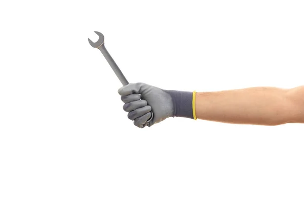 Hand holding a metal spanner on white background — Stock Photo, Image