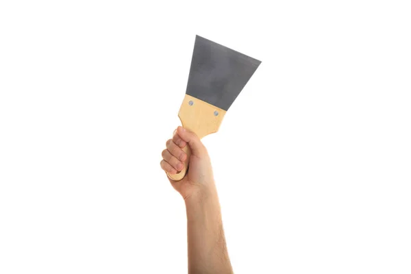 Hand holding a spatula on white background — Stock Photo, Image