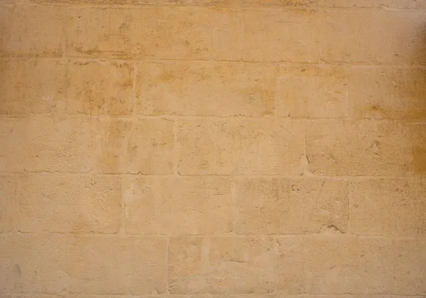 Tradiční zvětralé kamenné zdi pozadí na Maltě — Stock fotografie