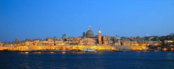 Valletta, Malta, Skyline in the evening with the dome of the Carmelite Church and the tower of St Paul 's
