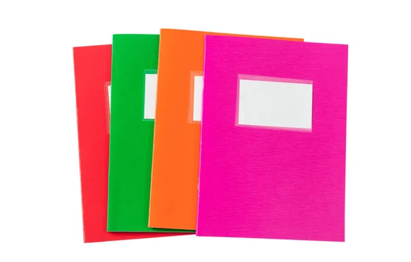Apilamiento de cuadernos escolares, anticuado, aislado sobre fondo blanco, etiqueta en blanco, espacio para copiar, vista superior —  Fotos de Stock