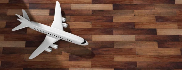 Airplane on wooden floor background, top view, copy space. 3d illustration — Stock Photo, Image