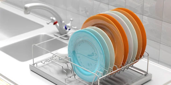 Estante de secado de platos con platos de colores en un mostrador de cocina blanco. ilustración 3d — Foto de Stock