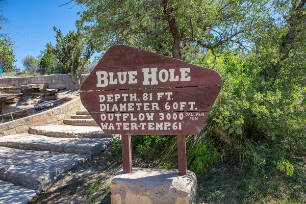 The wooden sign inform about the Blue Hole, the famous deep pool. Santa Rosa, New Mexico, US. — Stock Image The wooden sign inform about the Blue Hole, the famous deep pool. Santa Rosa, New Mexico, US. Stock Photo