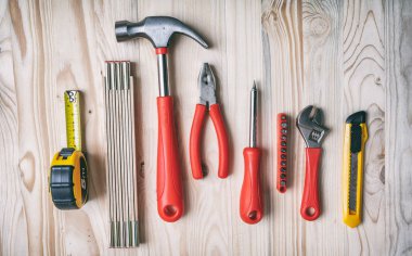 Tools set on wooden table,  top view.