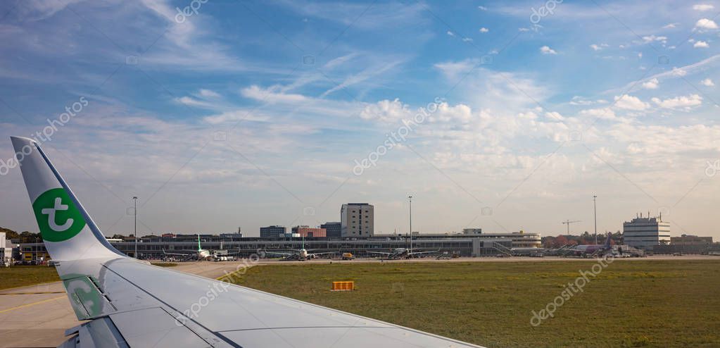 Eindhoven Netherlands. October 14, 2019. Transavia plane on the runway at Eindhoven airport, ready for take off. View out of airplane window.