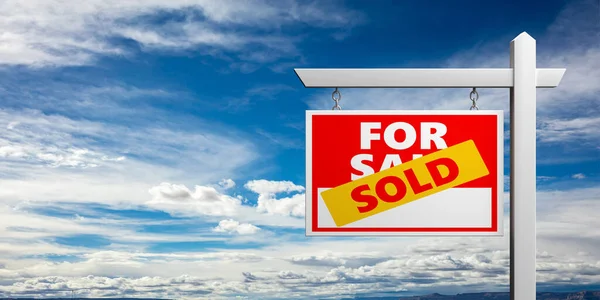 Sold for sale sign isolated against blue sky background. Real estate concept, copy space. 3d illustration