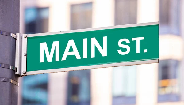 Main street sign, belváros, zöld szín, homályos épületek háttér — Stock Fotó