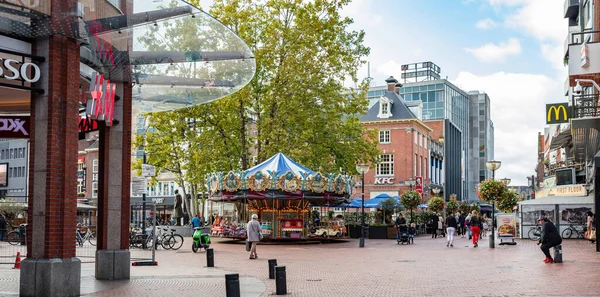 A vintage merry-go-round game in a paved square. Eindhoven, Netherlands. — Stock Photo, Image